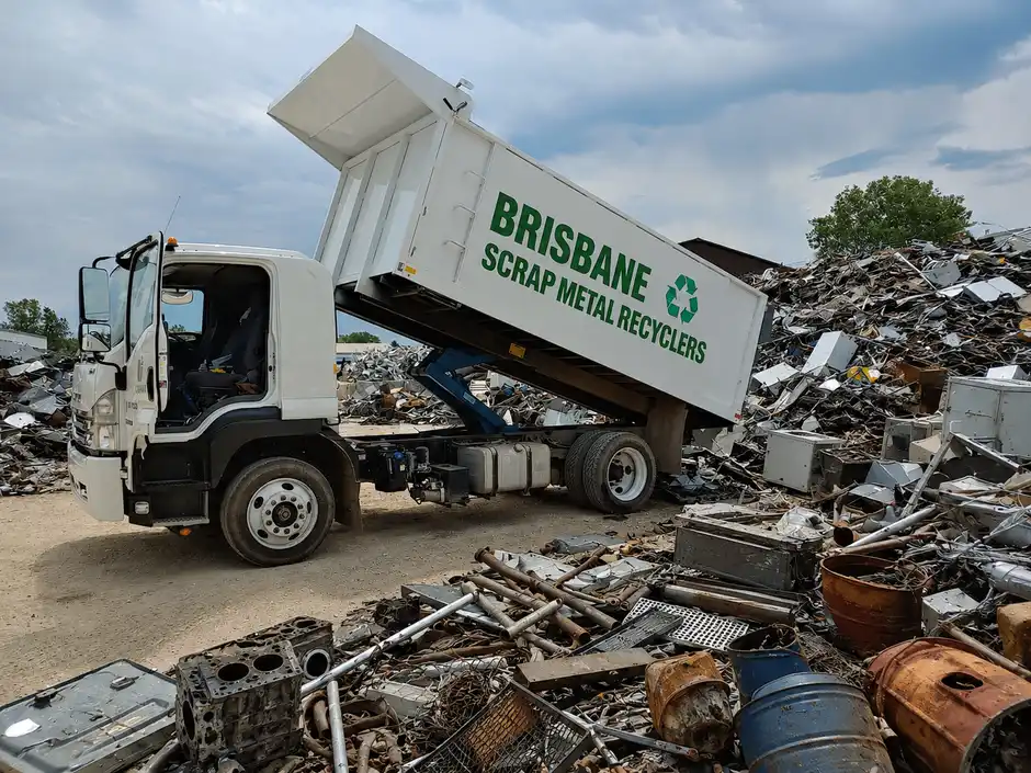 Mixed scrap metal offcuts and pipes loaded in a collection bin